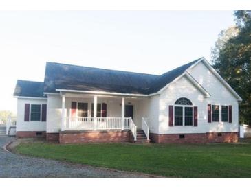 Charming single-story home featuring a welcoming front porch, red shutters and a well-maintained lawn at 154 Patrick Ln, Summerville, SC 29483