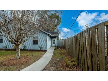 Charming single-story home featuring a well-maintained yard and inviting entryway at 2172 Palermo Pl, North Charleston, SC 29406