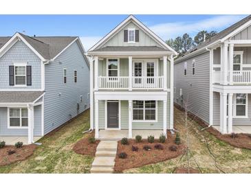 Charming two-story home featuring a welcoming front porch and second story balcony at 314 O'Malley Dr, Summerville, SC 29483