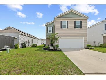 Charming two-story home featuring neutral siding, a two-car garage, and a well-maintained front lawn and landscape at 491 Cedarview Rd, Summerville, SC 29486
