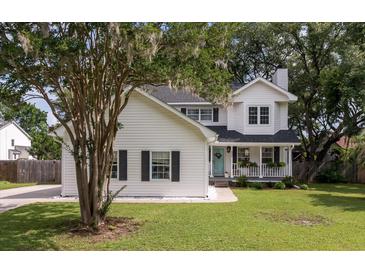 Charming two-story home with a welcoming front porch and beautiful lawn at 237 Dillard Dr, Goose Creek, SC 29445