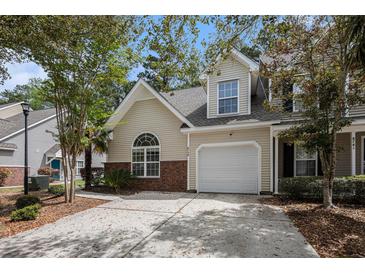 Charming home featuring a one-car garage, manicured landscaping, and a welcoming front entrance at 8739 Grassy Oak Trl, North Charleston, SC 29420