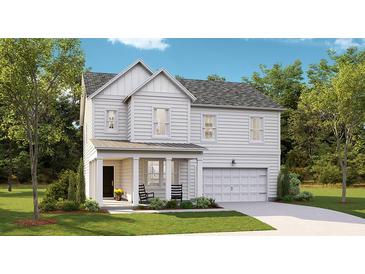 Charming two-story home features a covered porch, two-car garage, and manicured lawn at 1028 Scotch Bonnet Way, Summerville, SC 29485
