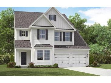 Charming two-story home with a manicured lawn and attached two car garage at 545 Verdi Drive Dr, Summerville, SC 29486