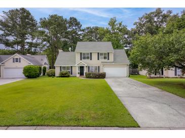 Charming two-story home with well-manicured front yard and inviting curb appeal at 633 Alwyn Blvd, Summerville, SC 29485