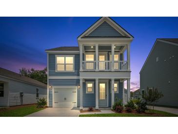 Charming two-story home with a covered porch and a one car garage at 116 Midmills Ln, Summerville, SC 29486