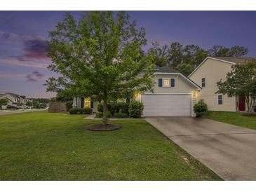 Charming home with a well-manicured lawn and a two-car garage at 341 Drayton Place Drive Dr, Moncks Corner, SC 29461
