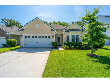 Charming single-Gathering home featuring a two-car garage, well-maintained lawn, and inviting curb appeal at 9710 Table Mountain Ln, Ladson, SC 29456