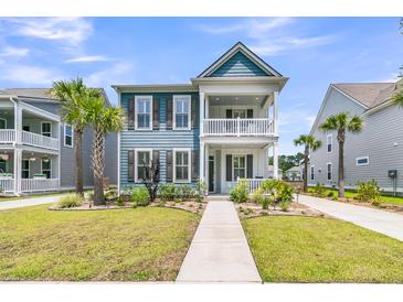 Charming two-story home with a double porch, landscaped yard, and inviting curb appeal in a vibrant neighborhood at 2219 Kemmerlin St, Johns Island, SC 29455