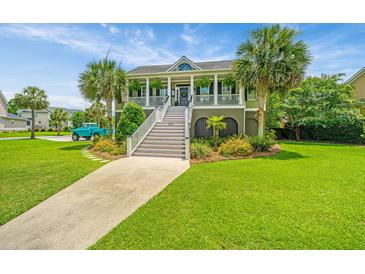 Charming two-story home with a landscaped yard, inviting staircase, and a picturesque view at 544 Two Mile Run, Johns Island, SC 29455