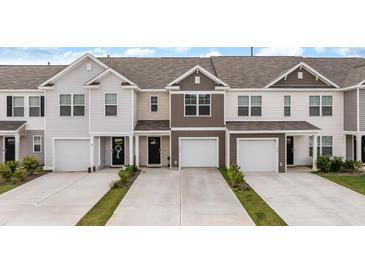 Charming townhomes with attached garages and modern exteriors in a well-maintained community at 266 Ivory Shadow Rd, Summerville, SC 29486