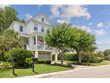 Charming two-story home featuring a welcoming front porch, well-maintained landscaping, and a convenient two-car garage at 732 Gate Post Dr, Mount Pleasant, SC 29464
