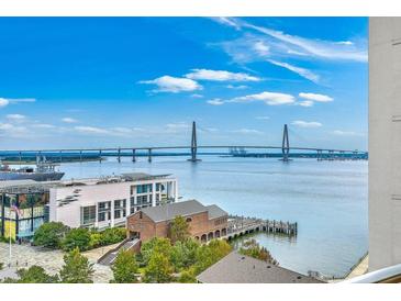 Stunning city view featuring a beautiful harbor and bridge on a bright, sunny day at 330 Concord St # 12C, Charleston, SC 29401