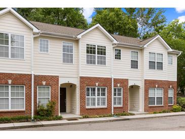 Inviting townhome showcases a classic brick facade and neutral siding at 241 Howle Ave # G, Charleston, SC 29412