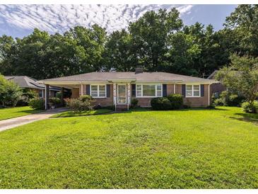 Charming brick home with well-maintained lawn and mature trees, located in a desirable neighborhood at 344 Canterbury Rd, Charleston, SC 29407