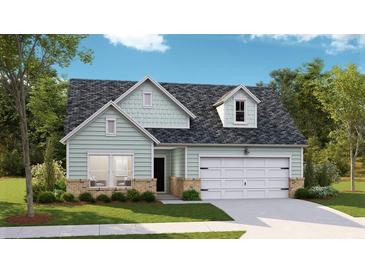 Charming single-Gathering home showcasing brick accents, gray roof, pleasant lawn, and an attached two-car garage at 1045 Tulip Shell St, Summerville, SC 29485