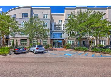 Attractive condo building featuring brick accents, meticulous landscaping, and convenient parking at 200 River Landing Dr # 307B, Charleston, SC 29492