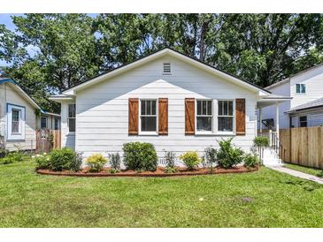Charming cottage-style home with beautiful landscaping and inviting curb appeal. Freshly painted, updated windows and shutters at 2949 Alabama Dr, North Charleston, SC 29405