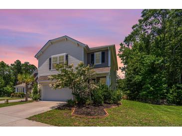 Charming two-story home with a well-maintained lawn and landscaping at 3745 Sawmill Ct, Mount Pleasant, SC 29429