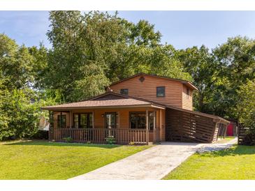 Charming two-story home with a covered porch and well-maintained lawn at 5904 Hagood Ave, Hanahan, SC 29410