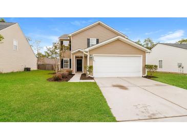 Charming two-story home with a well-maintained lawn and a two-car garage at 8285 Little Sydneys Way, North Charleston, SC 29406