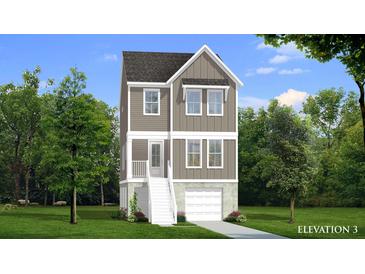 Charming two-story home features gray siding, white trim, a gabled roof, and an attached garage at 1086 Glenshaw St, North Charleston, SC 29405