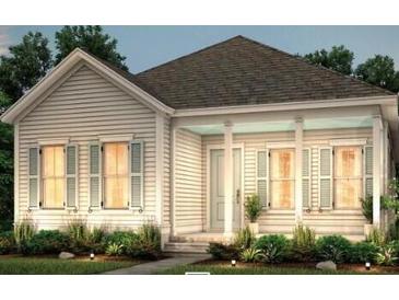 Charming single-story home featuring a covered front porch and light-colored siding at 313 Trailmore Ln, Summerville, SC 29486