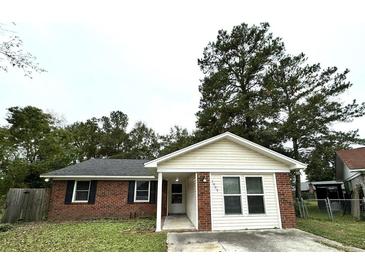 Charming brick and siding single-story home featuring a well-maintained front yard and welcoming entrance at 1005 Colony Ct, Summerville, SC 29486