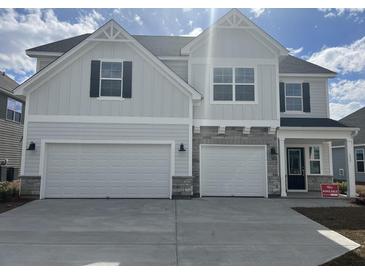 Charming two-story home featuring a three-car garage and stone accents at 178 Grange Cir, Summerville, SC 29486