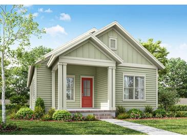 Charming single-story home features a covered porch, red door, and tidy landscaping at 226 Clearpath Dr, Summerville, SC 29486