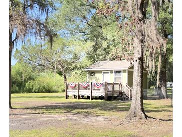 Exterior of a cute cottage with a deck at 4589 Prices Bridge Ln, Walterboro, SC 29488