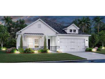 Charming one-story home with a two-car garage, stone accents, and a well-manicured lawn at 643 Red Monarch Way, Moncks Corner, SC 29461