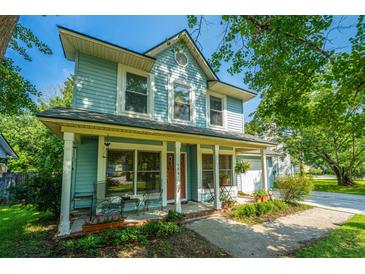 Charming two-story home with a welcoming front porch, landscaped yard, and inviting curb appeal at 103 Toura Ln, Charleston, SC 29414