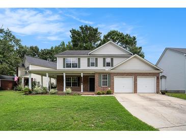 Charming two-story home with a covered front porch and a two-car garage at 133 Guildford Dr, Goose Creek, SC 29445