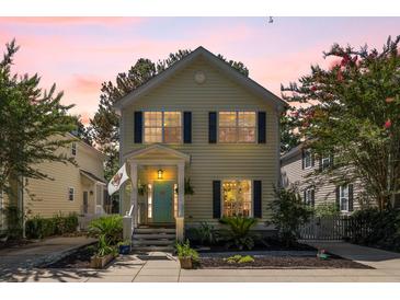 Charming two-story home with a colorful door, manicured landscaping, and inviting front porch at 1033 Mathis Ferry Rd, Mount Pleasant, SC 29464