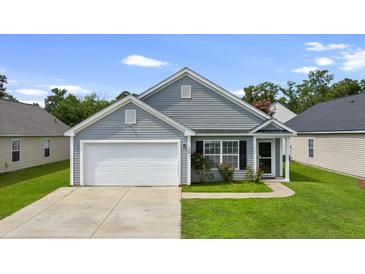 Charming single-Gathering home with a well-maintained lawn and attached garage, perfect for suburban living at 106 Maypop Dr, Goose Creek, SC 29445