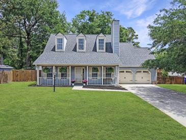 Charming two-story home with dormer windows, covered porch and well-manicured lawn at 1410 Diamond Boulevard, Mount Pleasant, SC 29466