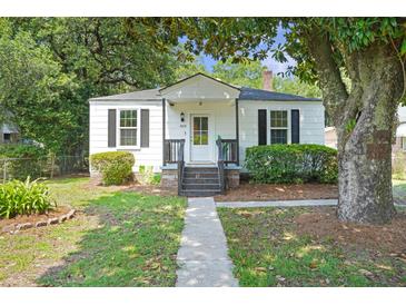 Charming, quaint single-story home featuring a walkway, black shutters, and a well-maintained front yard at 2608 Seymour Ave, North Charleston, SC 29405