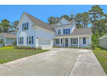 Charming two-story home featuring a spacious driveway, white siding, and delightful blue shutters and front door at 420 Oak View Way, Summerville, SC 29483