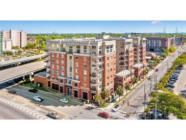 Stunning exterior of a multi-story brick condo building in an urban setting, perfect for city living at 150 Bee St # 308, Charleston, SC 29401