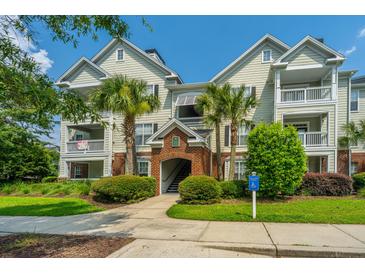 Inviting condo complex with manicured landscaping and covered walkways, offering a relaxed residential atmosphere at 45 Scyamore Ave # 623, Charleston, SC 29407