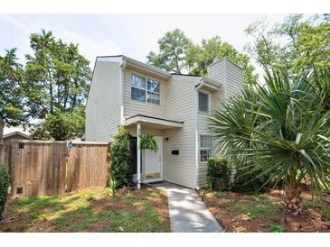 Charming two-story home with a light exterior, well-maintained landscaping, and a welcoming front entrance at 623 Bay Tree Ct, Mount Pleasant, SC 29464