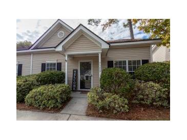 Charming single-story home with inviting front porch and well-maintained landscaping at 7322 Stoney Moss Way, Hanahan, SC 29410