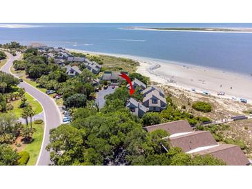 Aerial view of coastal home with beach access, surrounded by lush greenery, offering stunning ocean views at 341 Seabrook Island Rd, Seabrook Island, SC 29455