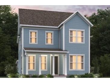 Charming two-story blue home with a covered porch and white pillars, surrounded by lush greenery and trees at 359 Trailmore Ln, Summerville, SC 29486