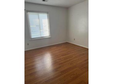 Bedroom with hardwood floors and a window providing natural light at 106 Teddy Ct, Summerville, SC 29485