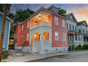 Charming two-story home with a covered porch and classic architectural details at 15 Dewey St, Charleston, SC 29403