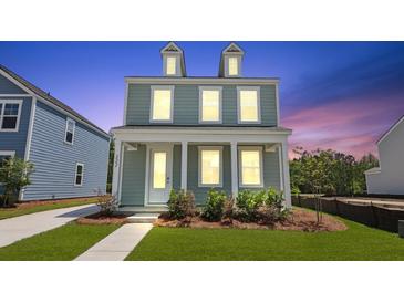 Charming two-story home with a covered front porch and manicured lawn at 222 Terrace View Dr, Summerville, SC 29486