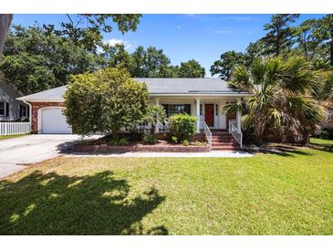 Charming single-story home with a well-manicured lawn and a welcoming front porch with white railings at 133 Bramwell Dr, Summerville, SC 29485