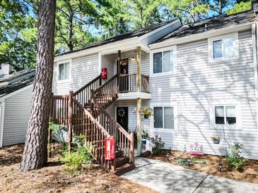 Charming condo with a gray exterior, wood stairs and inviting decor at 19 Rudwick Cir, Goose Creek, SC 29445